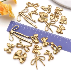Colgantes de lazo dorados de acero inoxidable para la creación de joyas y accesorios DIY
