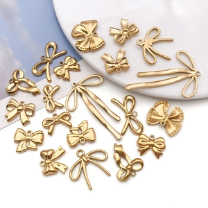 Set de colgantes de lazo dorado en acero inoxidable para creación de joyas DIY y artesanía