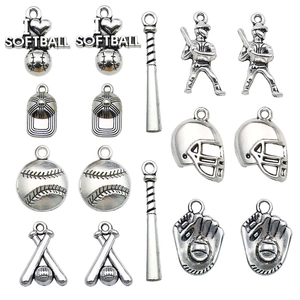 Detailed close-up of antique silver baseball and softball themed DIY jewelry charms and pendants