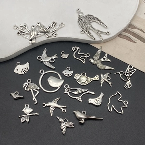 Vintage silver alloy bird charms including flamingos and swallows for DIY jewelry making