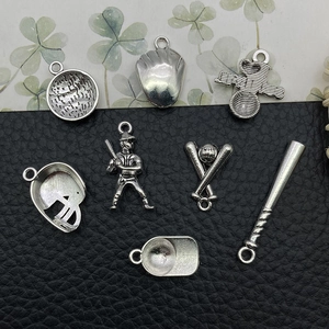 Detailed view of seven antique silver baseball themed DIY sports charms and pendants
