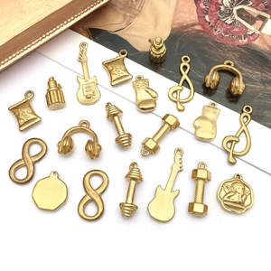 Gold stainless steel charms set with angel musical notes and dumbbell pendant styles
