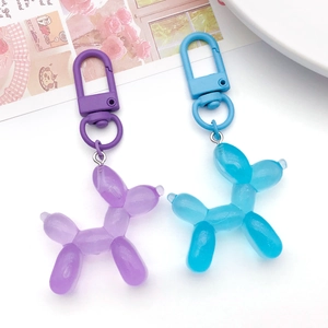 Balloon dog keychains in purple and blue translucent resin with sparkling glitter finish