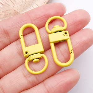 Macro shot of yellow matte finish alloy swivel lobster clasps for DIY accessories