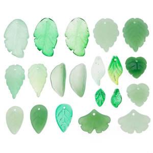 Assorted green glass leaf pendants including ginkgo and heart shapes for DIY jewelry making