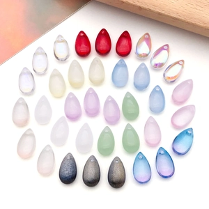 Detail of colorful teardrop glass charms with frosted and iridescent AB coating finishes