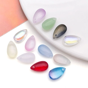 Macro detail of teardrop glass beads with top-drilled holes for DIY jewelry making
