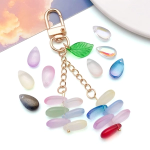 Multicolor glass teardrop beads keychain with golden D-ring and translucent green leaf charm