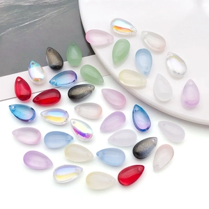 Macro detail of multi-colored teardrop glass beads with top-drilled holes for jewelry DIY