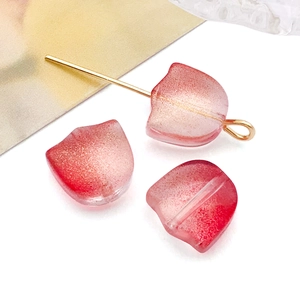 Close-up of frosted glass tulip petals with red gradient for handmade jewelry making