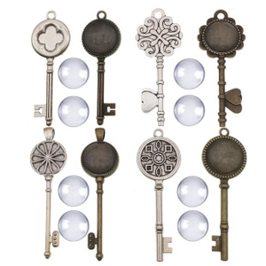 Macro view showing vintage alloy key charms with clear glass cabochons for DIY crafts