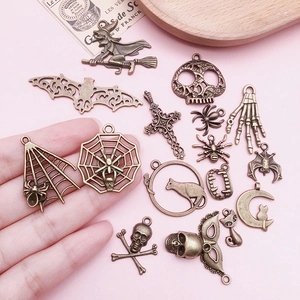Mix of 51 pieces bronze alloy Halloween charms including skull, bat and spider elements