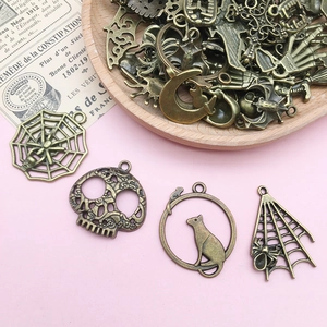 Mix of 51 antique bronze Halloween skull and spider alloy charms for DIY jewelry making