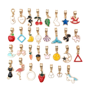 Detailed flat lay of colorful alloy crown and heart charms for DIY jewelry making