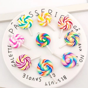 Detailed view of colorful resin lollipop charms with metal rings for DIY jewelry projects