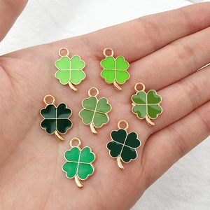 Mix of 48 green clover charms with gold metal edges for DIY bracelet and jewelry making