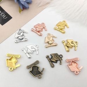 Miniature graduation cap and scroll alloy charms in gold, silver and bronze colors