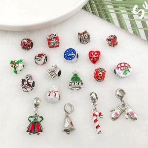 Detailed set of 18 Christmas charms including Santa and Snowflakes with enamel finish
