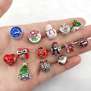 Handheld Christmas charm set featuring Santa, snowflakes and reindeer for DIY bracelets