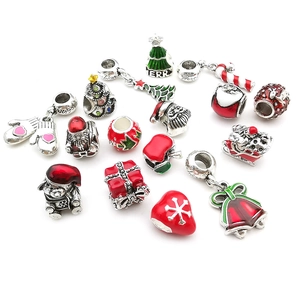 Detailed close-up of Christmas series silver charms with colorful enamel holiday patterns