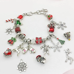 Silver plated Christmas charm bracelet with Santa, snowflake, and reindeer pendants