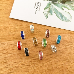 Detailed view of colorful rhinestone metal spacer beads for DIY jewelry making sets