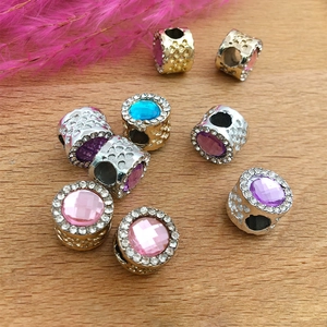 Macro shot of large hole crystal charms with multi-color stones for DIY jewelry making