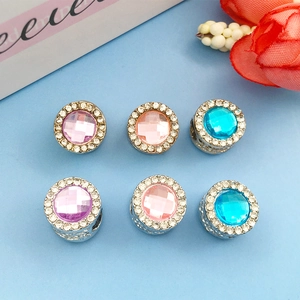 Macro shot of 6 large hole beads with silver base and colorful rhinestones for DIY bracelets