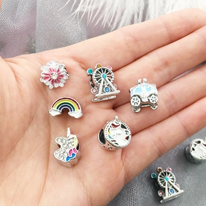 Macro detail of fairy tale beads featuring rainbow and unicorn for DIY bracelets