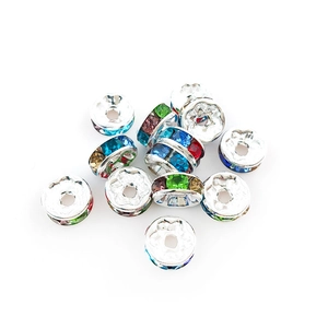 Macro detail of colorful crystal spacer beads with silver alloy base for DIY jewelry