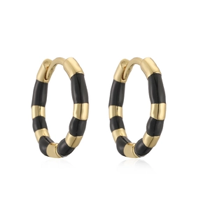 Detailed close-up of gold-plated bamboo hoop earrings with black enamel sectional design