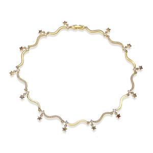 Close-up of golden wavy link necklace with multi-colored gemstone star charms