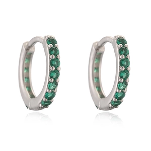 Detailed view of silver hoop earrings with prong-set green round-cut cubic zirconia