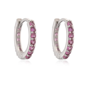 Detail view of silver hoop earrings featuring meticulously set round pink zircons