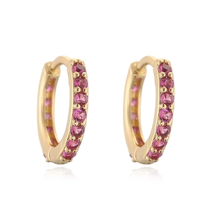 Detailed close-up of golden hoop earrings with pink round-cut cubic zirconia stones