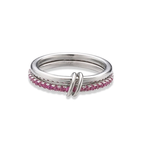 Detail of silver interlocking rings featuring minimalist band and pink crystal pavé setting