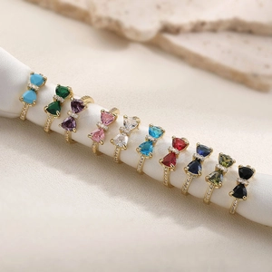 Luxurious adjustable bow ring with colorful crystals and sparkling diamonds in gold finish