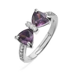 Macro detail of silver bow ring featuring purple triangle crystals and tiny diamonds