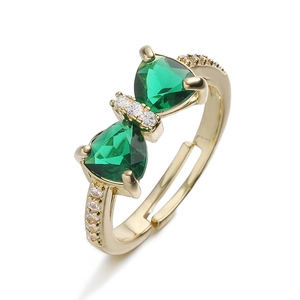 Elegant adjustable bow ring with emerald green crystals and sparkling micro-pave accents
