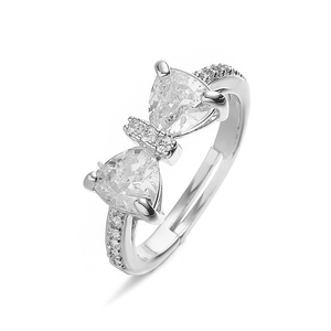 Detail of a sparkling bow-shaped ring with triangular clear stones and an adjustable band