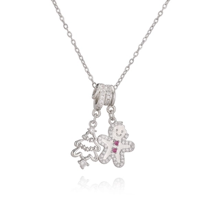 Collier de Noël argenté avec pendentifs bonhomme en pain d'épices et sapin évidé