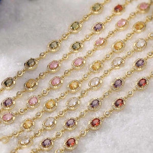 Vintage gold bracelets set with colorful oval gemstones and sparkling halo accents