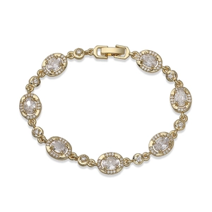 Detail of vintage gold bracelet featuring oval crystals and pave-set diamond accents