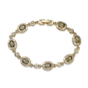 Close-up of gold-plated bracelet featuring oval green stones and clear zircon accents