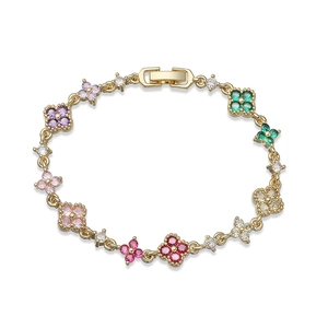 Elegant gold bracelet with colorful zircon clover charms and secure folding clasp closure