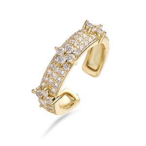 Macro shot of three-row pave white zircons on a gold-plated adjustable clover ring