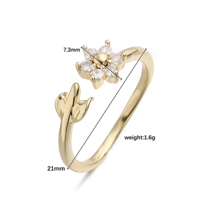 Luxury gold flower ring with white zircon petals and leaf detail with size specs
