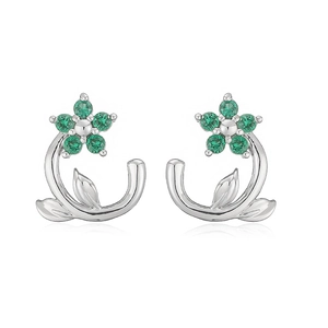 Detail of silver camellia earrings with green crystals and delicate leaf design