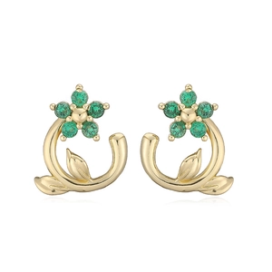 Detail of camellia flower earrings with green crystal petals and golden plating