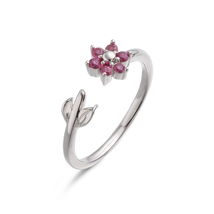 Detailed macro shot of silver floral open ring with pink crystals and leaf accents